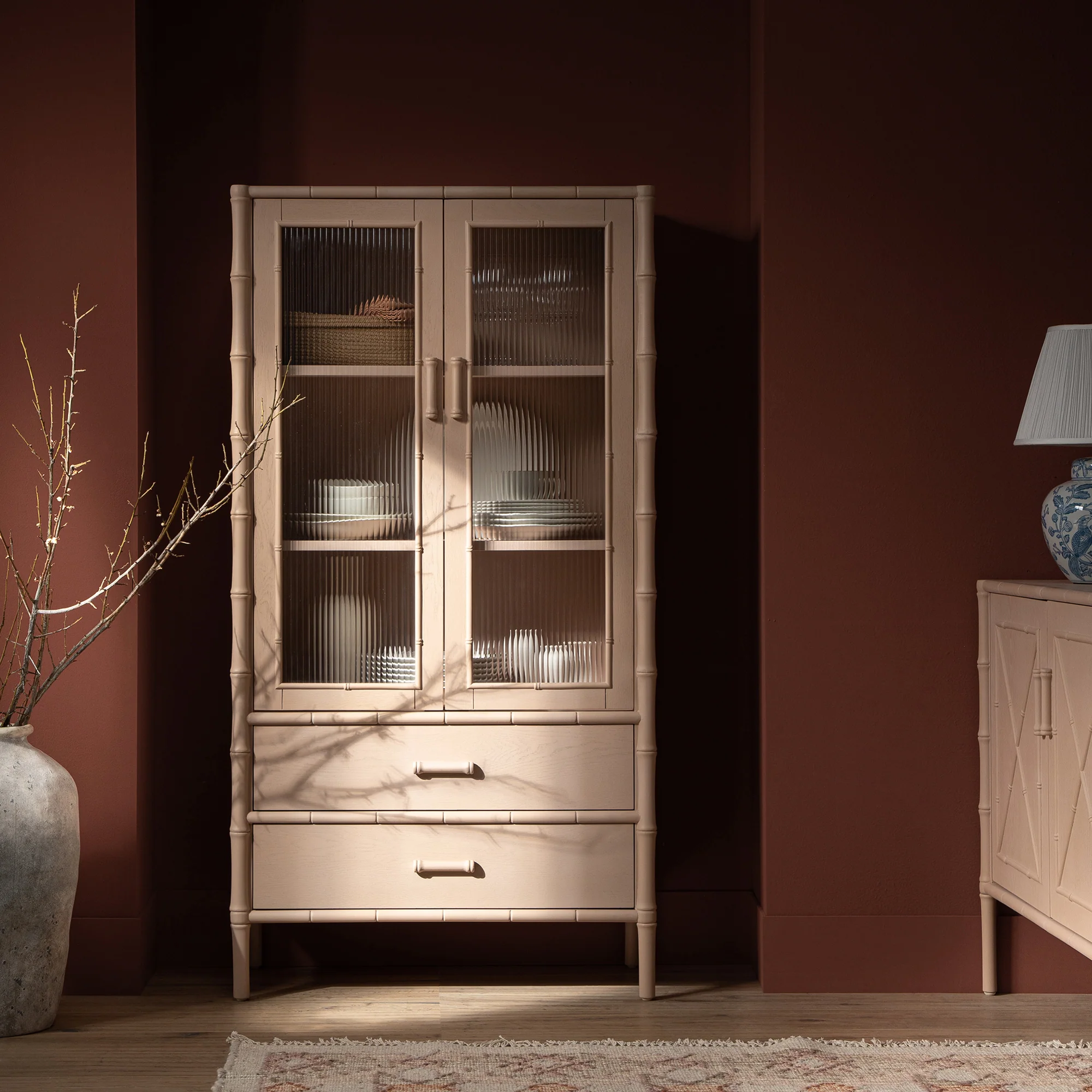 Elstowe Faux Bamboo and Fluted Glass 2-Door Cabinet, Nude Pink